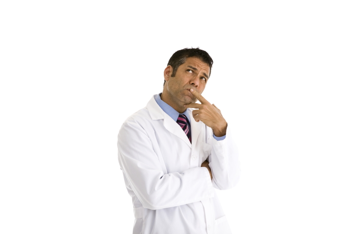 Doctor in white coat, thinking